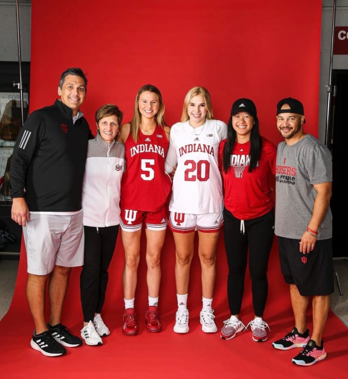 Lenée Beaumont poses with Indiana associate coach Rhet Wierzba, coach Teri Moren, assistant coach Linda Sayavongchanh and associate head coach Glenn Box.